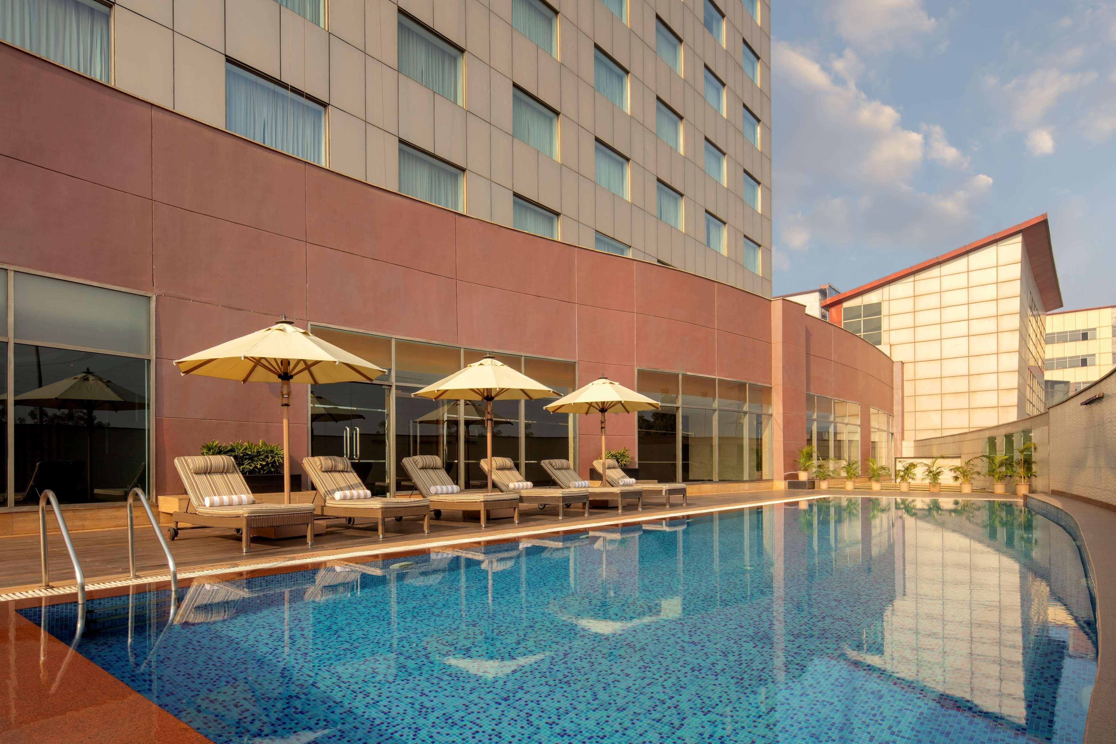 Radisson Gurugram Udyog Vihar Hotel Gurgaon Exterior photo The pool at the hotel