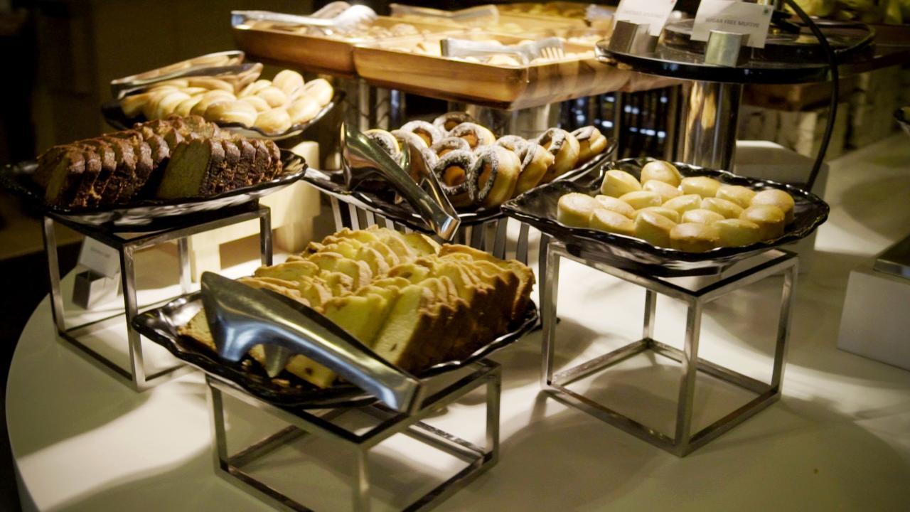 Radisson Gurugram Udyog Vihar Hotel Gurgaon Exterior photo A selection of desserts
